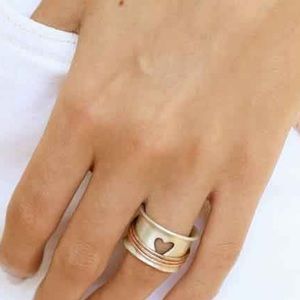 Size 8 custom ring. Very cool chunky silver with brass rings.